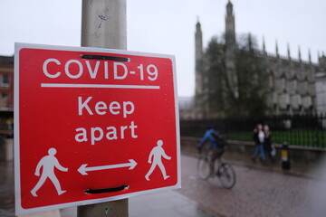 Red sign saying Keep Apart, refering to mandatory social distancing in the united kingdom beacuse...