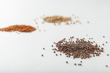 Cabbage, watercress, coriander seeds on white textured background