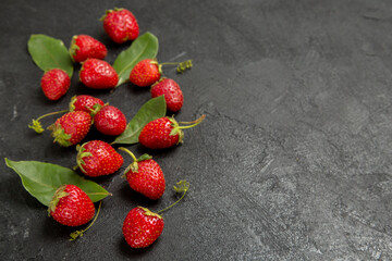 front view fresh red strawberries on the dark background berry ripe fruit color