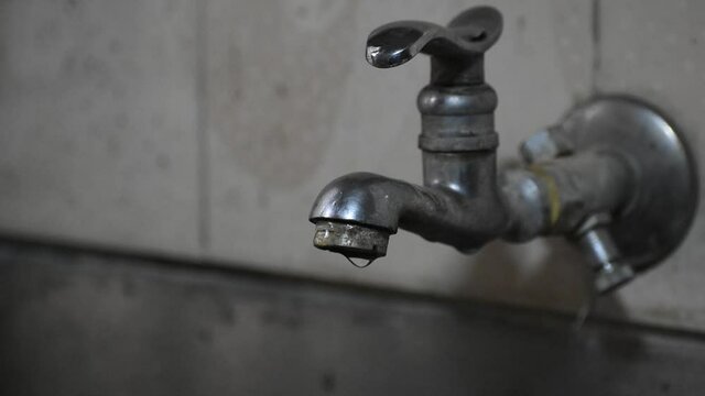 Water wastage from the tab due to undermaintained plumbing  causing water wastage 