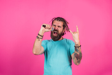 Singer. Sing a song. Bearded man sing in microphone. Microphone. Karaoke. Man singing with microphone. Rock.