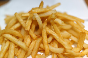 Close-up of French Fries on a table in a fast-food restaurant.