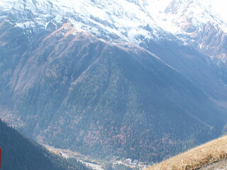 snowy mountain peaks in fog