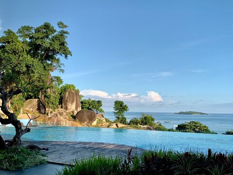 Pool and ocean view against the sky