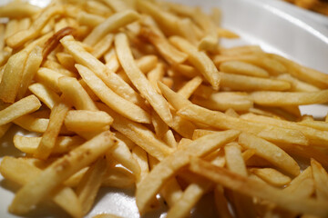 Close-up of French Fries on a table in a fast-food restaurant.