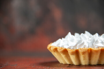 front view small tart with pastry cream on dark red background copy space