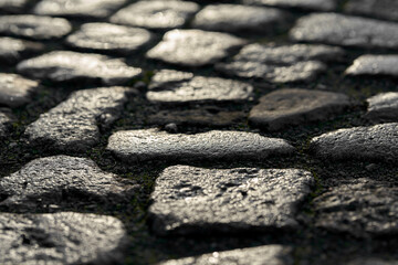Cobbles of a street at sunset