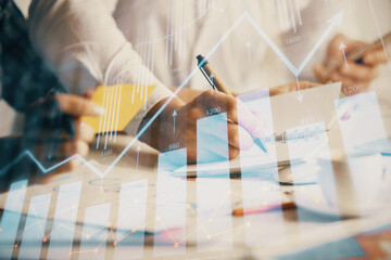 Double exposure of forex graph drawing over people taking notes background. Concept of financial...