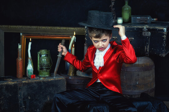 Portrait of a boy in the image of a vampire in the studio