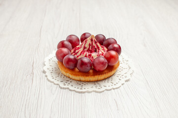 front view delicious cake with grapes on white background dessert biscuit pie