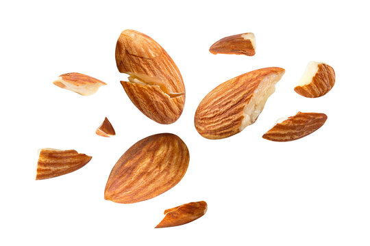 almonds baked pieces snack  and cracks Spread out  on white isolated .Clipping path -