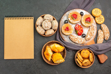 top view yummy pancakes with fruits and sweet cakes on dark floor dessert sweet cake