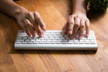 Typing keyboard on white on black Desk, Home Office, Mobile Work