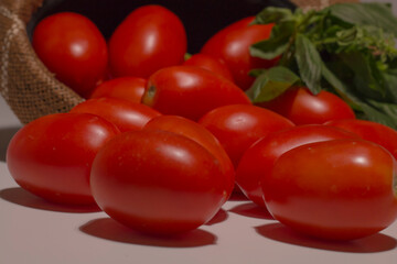 delicious red tomatoes with herbs. Group of tomatoes. healthy and fresh italian vegetables