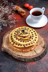 front view delicious sweet pancakes with cup of tea on dark background dessert cake milk