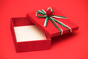 Red gift box for christmas theme on the red background.