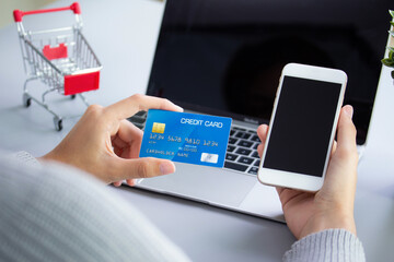 hand on credit paymant with phone