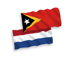 Flags of East Timor and Netherlands on a white background