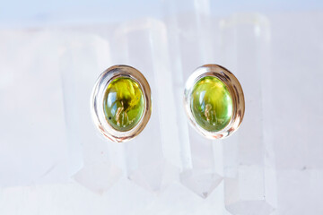 Sterling silver with natural olivine mineral gemstone on bright neutral background - 400362906