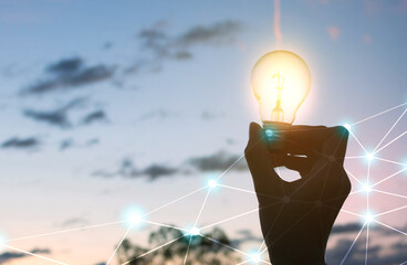 women holding light bulbs,creative idea  innovation with  technology in sunset time
