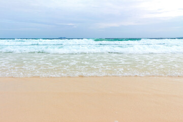 Blue ocean wave on sandy beach  summer day