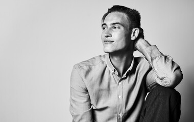 Romantic man in a shirt and trousers on a light background photograph portrait gray color