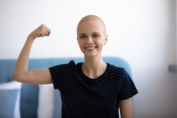 Own example. Portrait of strong willed female cancer patient having power to overcome disease. Self...