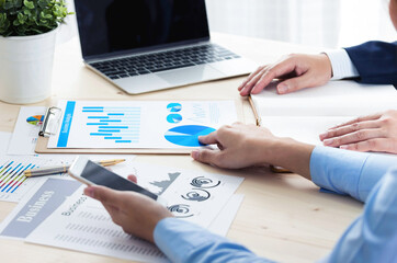 business woman point center of a target. Image over a charts  graphs sheets with partnership