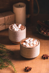 Hot cocoa with marshmallow in ceramic cups