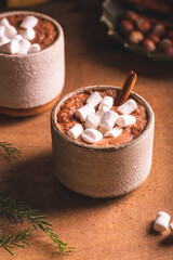 Obraz na płótnie Canvas Hot cocoa with marshmallow in ceramic cups