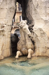 Fototapeta na wymiar View of The horse statue of the Fountain of the Four Rivers at Piazza Navona in Rome, Italy.