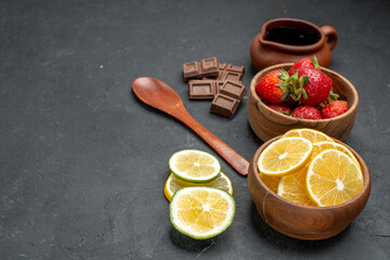 front view fresh fruits strawberries and lemons on gray background fruit fresh vitamine