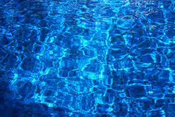 Swimming Pool Surface With Light Reflection and Water Ripple Patterns