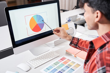 Designer looking at colour chart - obrazy, fototapety, plakaty