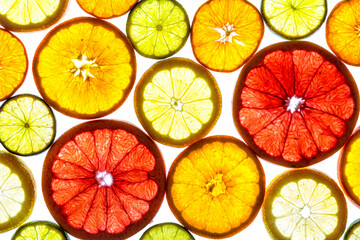 Collage of various fruit slices isolated on a white background.