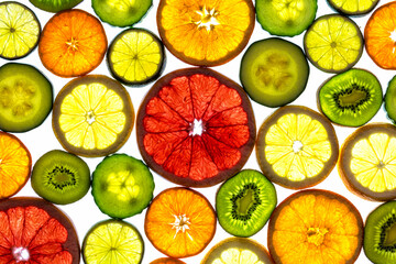 Collage of various fruit slices isolated on a white background.