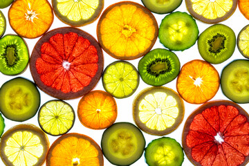Collage of various fruit slices isolated on a white background.