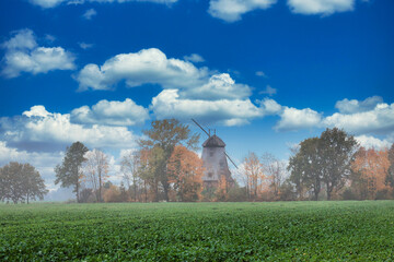 Fototapeta na wymiar landscape with windmill and clouds