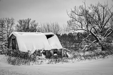An old barn in the small town of Windsor in Broome County in Upstate NY is covered in snow. A...