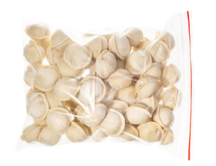 frozen Pelmeni (russian dumplings filled with minced meat) in transparent bag isolated on white background