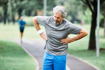 senior man running exercising sport fitness chest pain heart attack