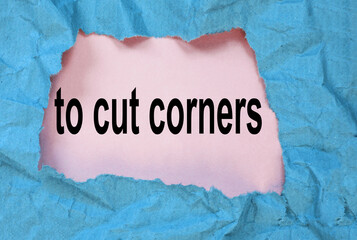 to cut corners-a message through a hole in crumpled wrapping paper, a conceptual image, a top view
