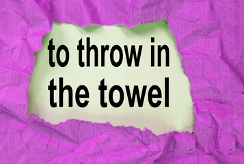 throw in the towel-phrase message through a hole in the crumpled wrapping paper, conceptual image,...