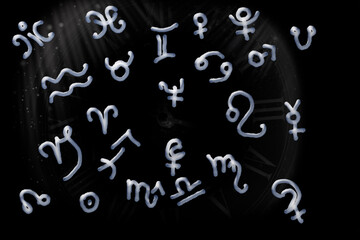 Fototapeta na wymiar Astrological horoscope symbols on black background 