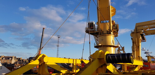 Crane lifts a metal frame 