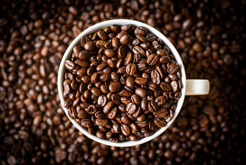 Roasted coffee beans in a cup