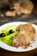boiled beef tongue sliced in a plate