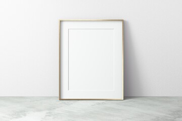 Empty golden metal frame on wall. Blank space