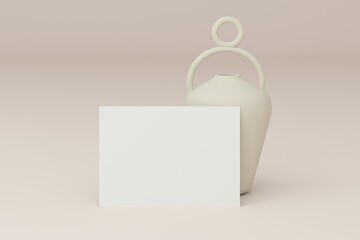 Blank white 5x7 card on ceramic vase