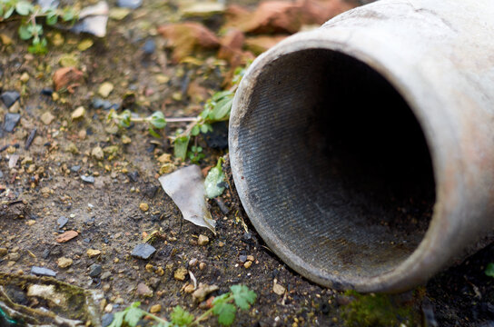 Photo of concrete pipe on junkyard